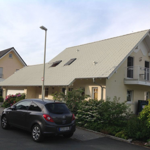 Beschichtung eines Eigenheims in Kieselgrau in Bonn