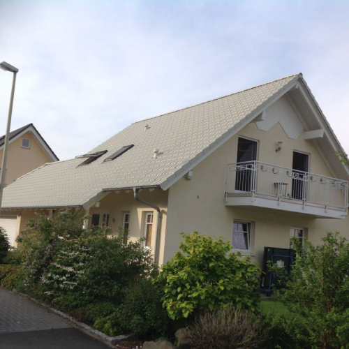 Beschichtung eines Eigenheims in Kieselgrau in Bonn