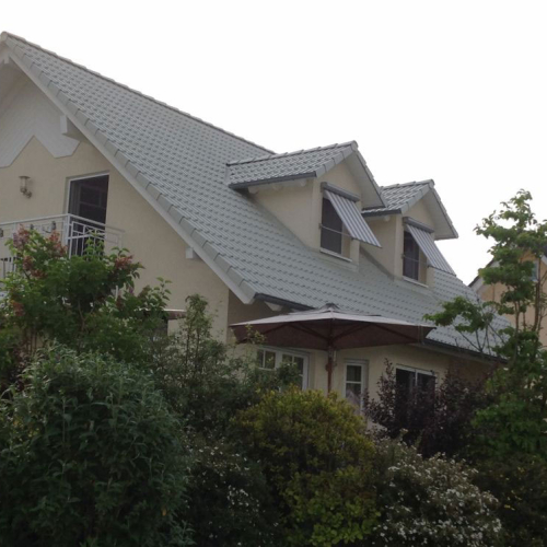 Beschichtung eines Eigenheims in Kieselgrau in Bonn
